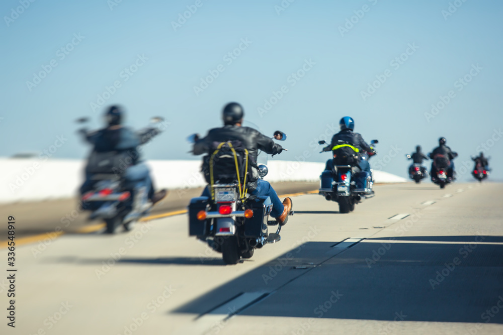 Band of bikers riding on the interstate road, California, group of motorcycles on the Highway, on the way to Las Vegas from Los Angeles in San Bernardino city, California, United States, biker concept Band of bikers riding on the interstate road, California, group of motorcycles on the Highway, on the way to Las Vegas from Los Angeles in San Bernardino city, California, United States, biker concept