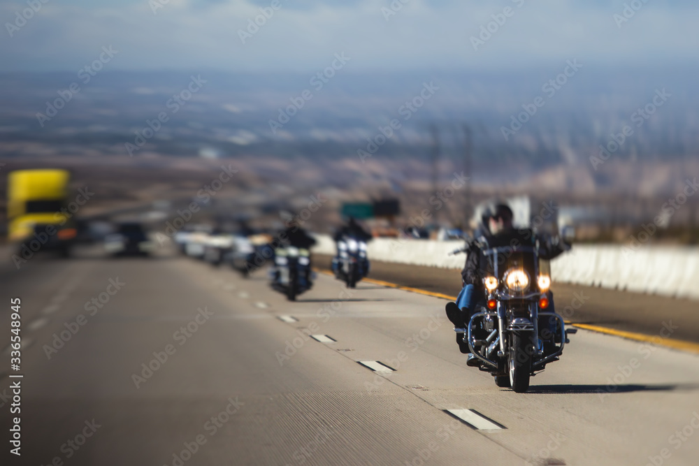 Band of bikers riding on the interstate road, California, group of motorcycles on the Highway, on the way to Las Vegas from Los Angeles in San Bernardino city, California, United States, biker concept Band of bikers riding on the interstate road, California, group of motorcycles on the Highway, on the way to Las Vegas from Los Angeles in San Bernardino city, California, United States, biker concept