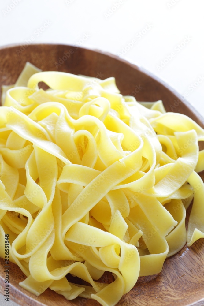 Italian food, prepared fettuccine flat pasta on plate