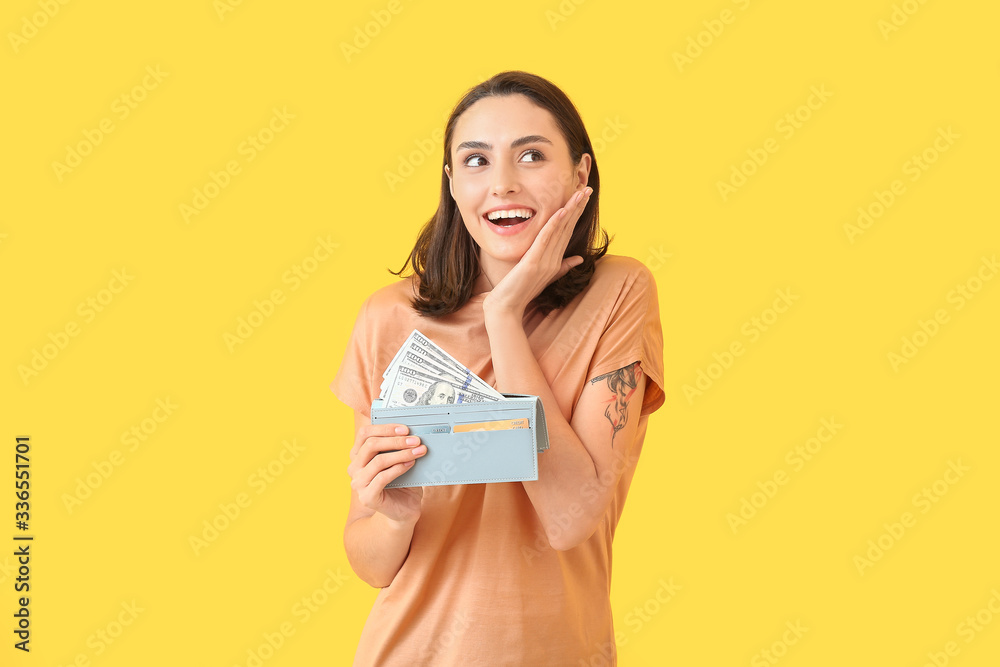 Young woman with wallet on color background Young woman with wallet on color background
