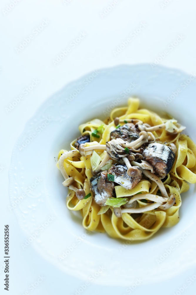 Italian food, sardines and fettuccine pasta
