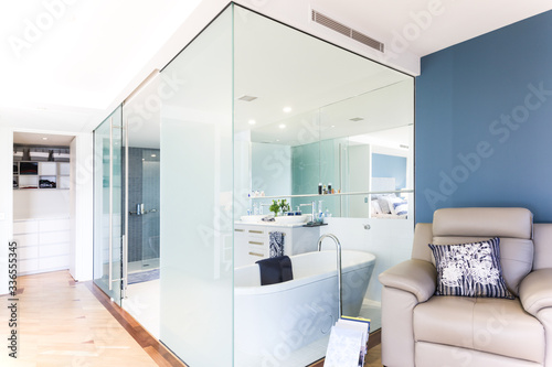 Glass bathroom with timber flooring