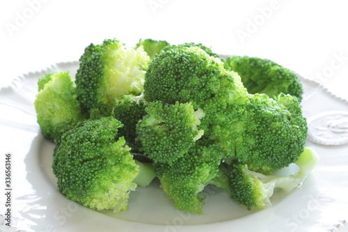 Boiled broccoli on dish with copy space