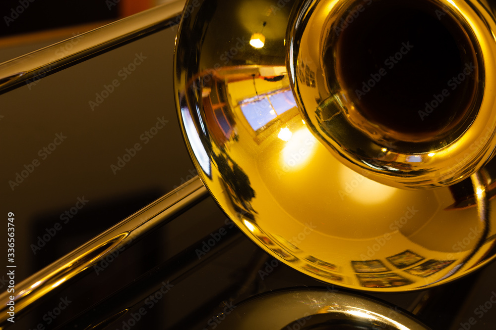 closeup of tenor trombone on the table - obrazy, fototapety, plakaty 