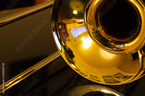 closeup of tenor trombone on the table photo