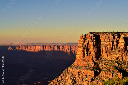 Grand Canyon national park with sun casting shadows onto valley floor colorado river at sunrise sunset.