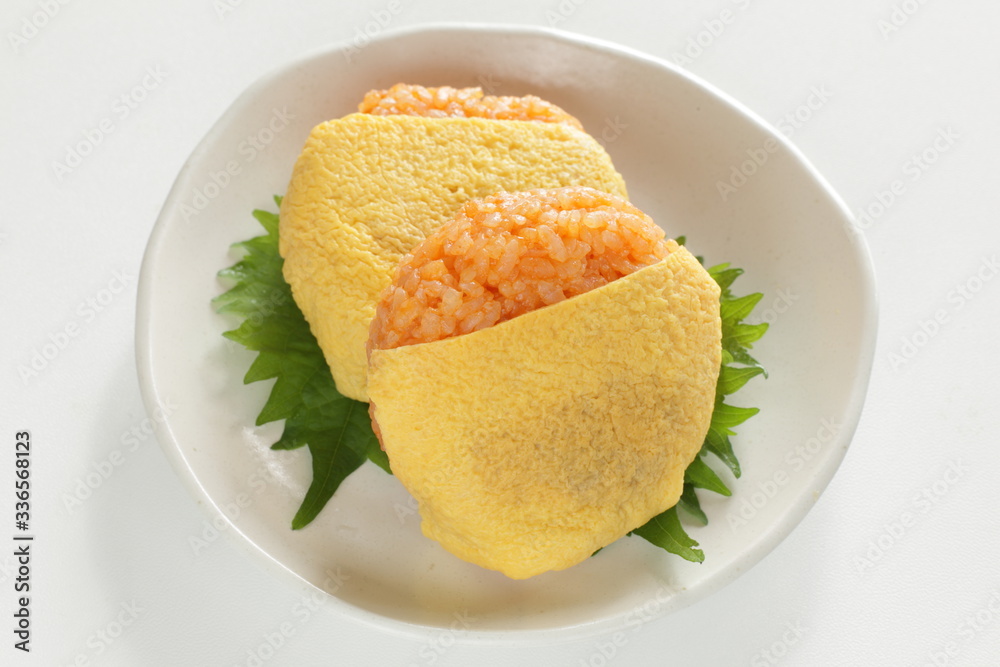 Japanese food, ketchup and wrapped egg rice ball Japanese food, ketchup and wrapped egg rice ball