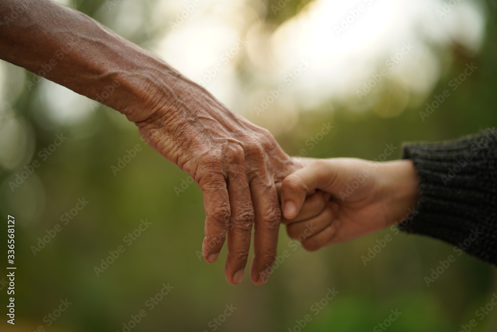 senior couple holding hands