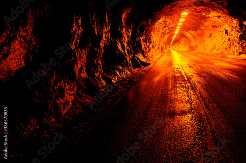 Red lights of the Wawona Road tunnel at night in Yosemite National Park photo