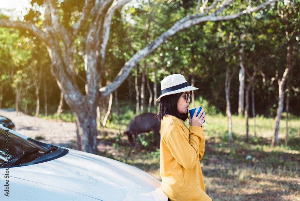 Asian woman hands drinking hot coffee in the morning at nature,Relaxing time Asian woman hands drinking hot coffee in the morning at nature,Relaxing time