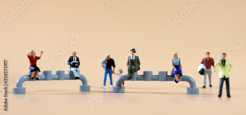 The concept of social distancing. Various miniature people.

