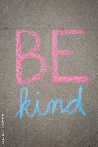 Be Kind words written with sidewalk chalk