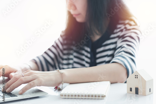 Woman using laptop and work...