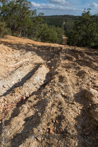 Brown muddy clay off road way in Australian country side