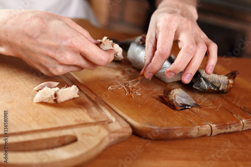 Removing skin and bones from smoked mackerel