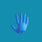 A blue medical glove on the plain background