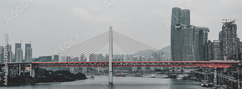 Chongqing, China - Dec 21, 2019: Panorama view of Qian si men suspension bridge over Jialing river photo