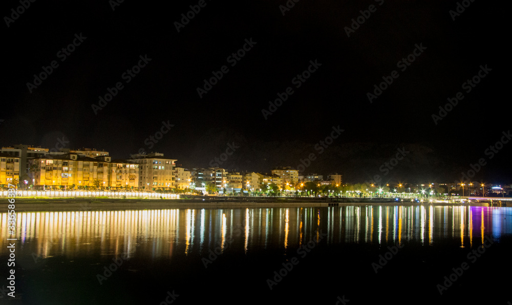 Nght river in Antalya Konyalti and the town line at night time