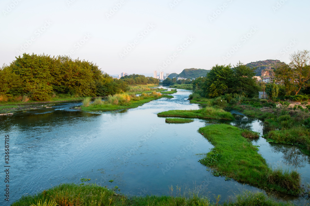 The calm river at sunset The calm river at sunset