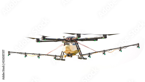 Fototapeta Naklejka Na Ścianę i Meble -  Agriculture drone flying over the rice field to sprayed chemical or fertilizer. Technology for agriculture concept
