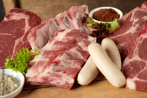 Assorted raw meat for grilling on a BBQ