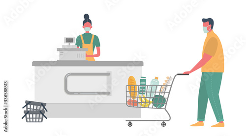 Supermarket cashier during coronovirus epidemic. Young woman in a medical mask stands behind a cash register. Buyer is also wearing a protective mask. There is a shopping cart full of food here