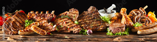 Various barbecued gourmet meats on timber board photo