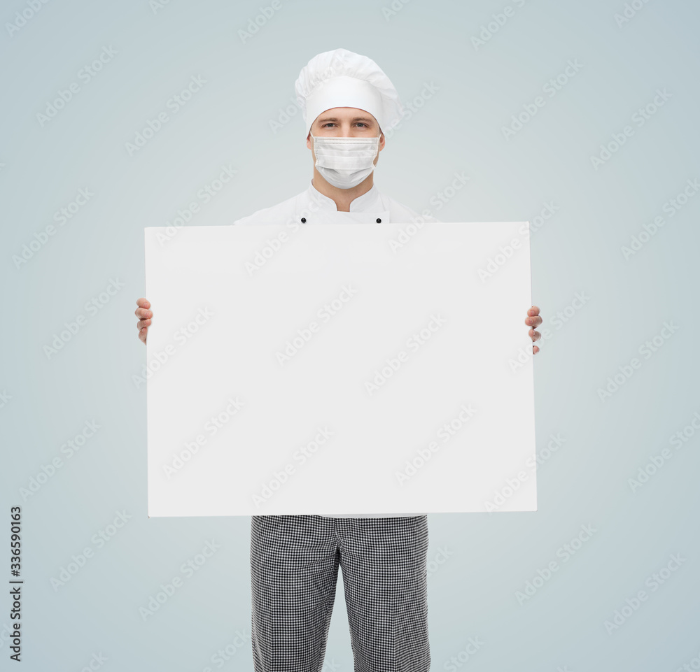 health, safety and pandemic concept - male chef, cook or baker wearing face protective medical mask for protection from virus disease with white billboard over health, safety and pandemic concept - male chef, cook or baker wearing face protective medical mask for protection from virus disease with white billboard over