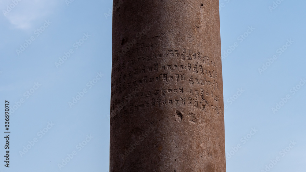 close up of engraving on the iron pillar at qutub minar in delhi