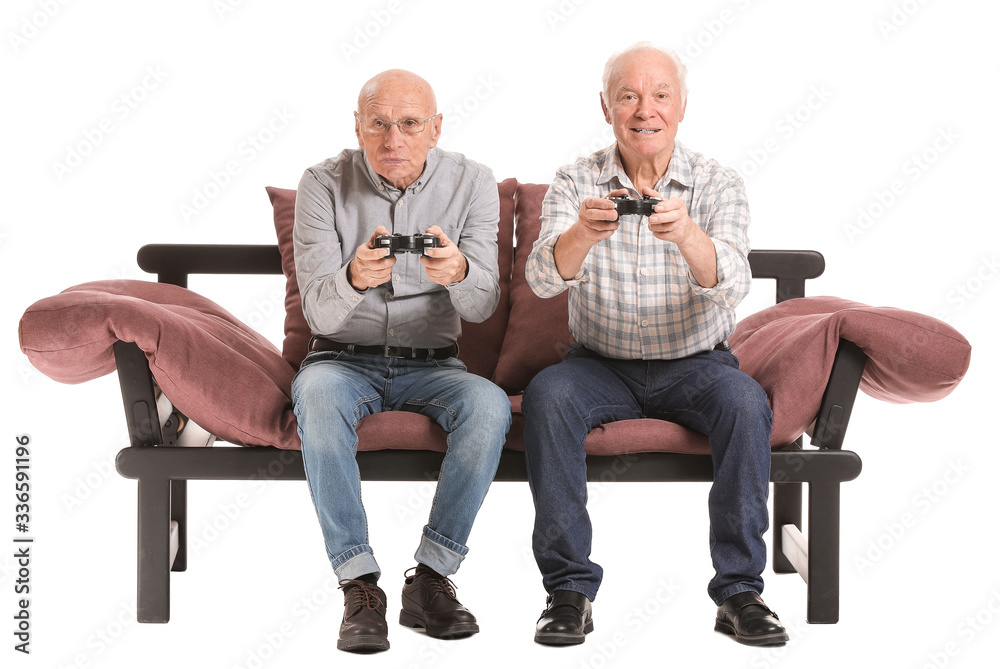 Portrait of elderly men playing video games on white background Portrait of elderly men playing video games on white background