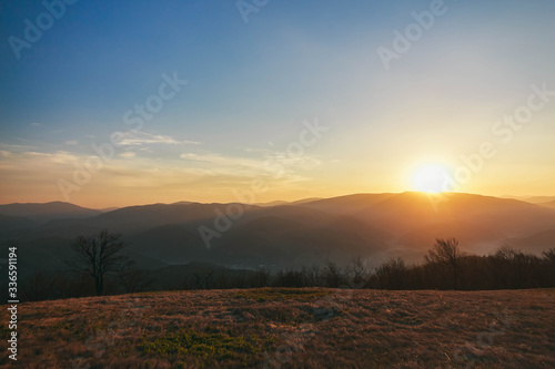 Beautiful Carpathians, mountains in clouds, waterfall, close-up, the sunsets beautifully over the mountains