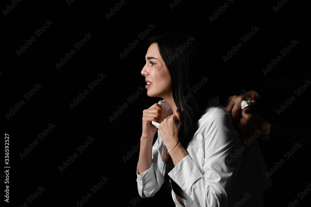 Angry husband trying to kill his wife on dark background. Concept of domestic violence Angry husband trying to kill his wife on dark background. Concept of domestic violence