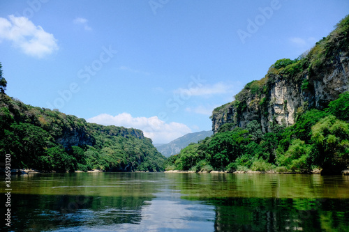 Mexico Canyon Sumidero Canyon with a river with very high cliffs covered with greenery. One of the largest canyons in Mexico. Bottom view
