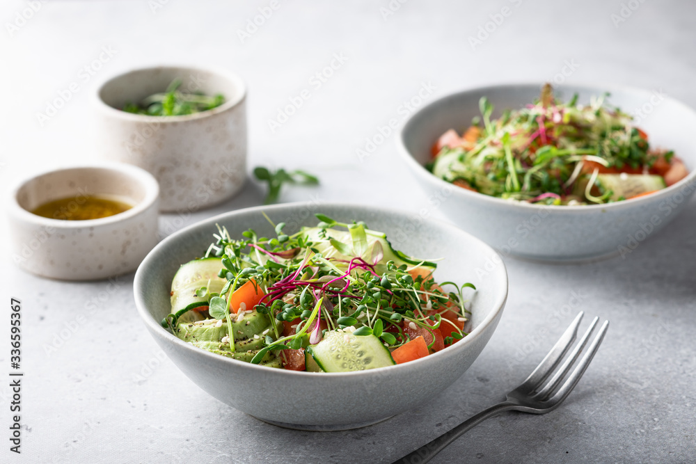 Healthy vegetarian salad bowl - vegetables, micro greens, avocado, sesame .