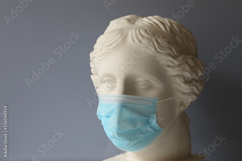 Gypsum head of Venus with a mask put on, illustrating strict quarantine measures