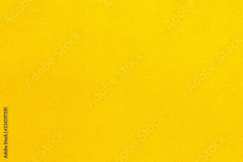 Colorful yellow cement textured wall