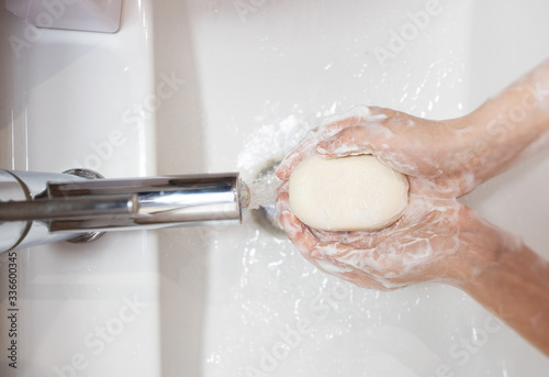 thorough washing of female hands  soap and water