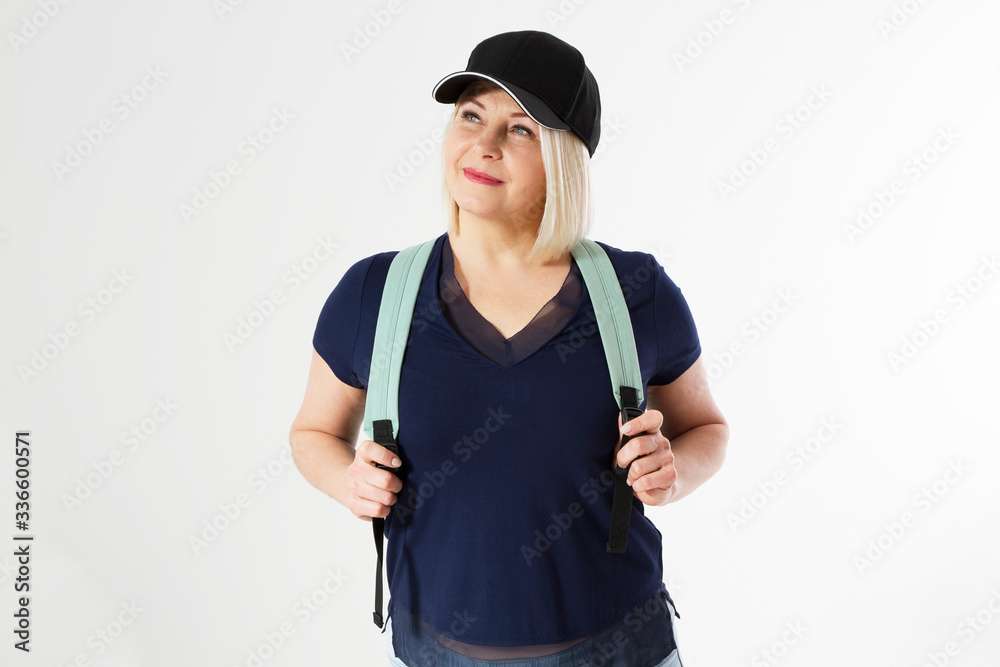 Active friendly middle age woman with black blazer cap and backpack isolated Active friendly middle age woman with black blazer cap and backpack isolated