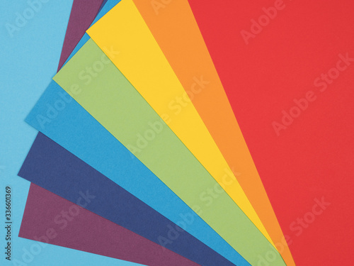A palette of seven colors of the rainbow on a blue background.