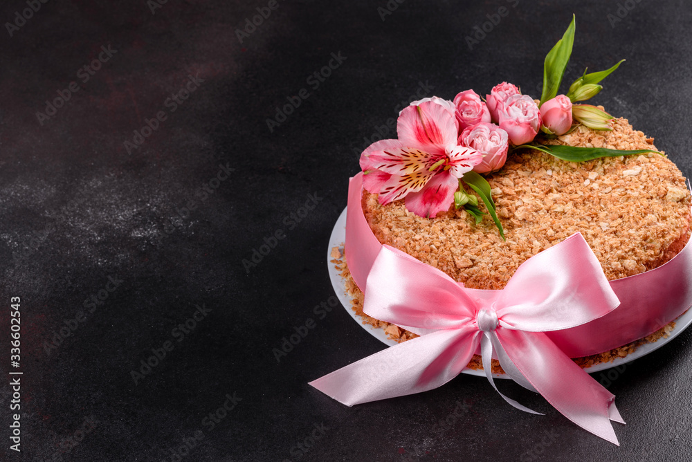 Fresh delicious cake napoleon with cream on a dark background Fresh delicious cake napoleon with cream on a dark background