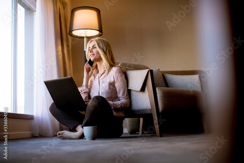 Young woman sitting on the ...