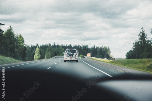 Car driving on winding road for new adventures POV