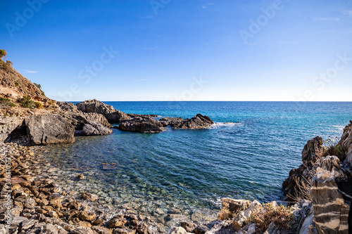 A beautiful beach accesible by a tunnel in a rock, (telegraph tip) Punta del Telegrafo on the Tyrrhenian coast of Ascea Marina. Cilento, Salerno, Campania, Italy