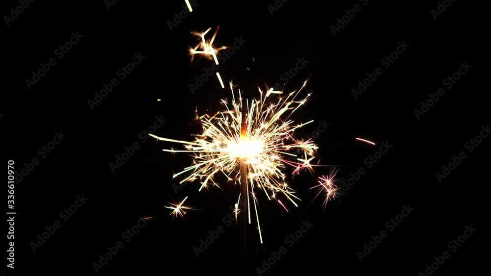 Holiday party concept. Bengal lights are burning on a black background. Decorative element of holiday mockup. Holiday party concept. Bengal lights are burning on a black background. Decorative element of holiday mockup.