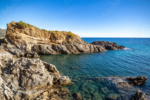 Fototapeta Naklejka Na Ścianę i Meble -  A beautiful beach accesible by a tunnel in a rock, (telegraph tip) Punta del Telegrafo on the Tyrrhenian coast of Ascea Marina. Cilento, Salerno, Campania, Italy