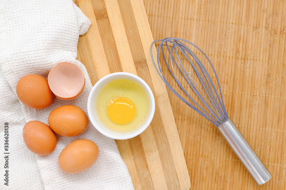 Close-up view of raw chicken eggs on wooden background
Close-up view of raw chicken eggs on wooden background