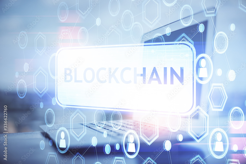 Multi exposure of blockchain and crypto economy theme hologram and table with computer background. Concept of bitcoin cryptocurrency. Multi exposure of blockchain and crypto economy theme hologram and table with computer background. Concept of bitcoin cryptocurrency.