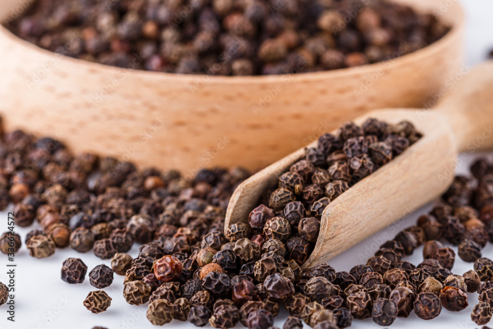 fragrant black pepper on white acrylic background fragrant black pepper on white acrylic background