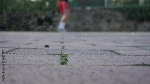 Low angle out of focus shot of person jumping on skipping rope,staying at home during corona pandemic photo