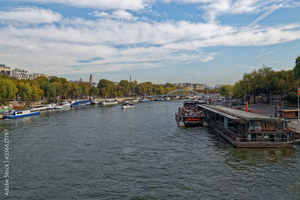 Looking from a Bridge across the Seine and the River Traffic, to the Debilly Bridge in the distance.